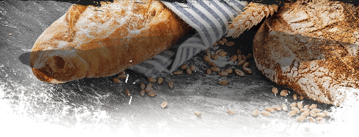 Fresh bread loaves on a dark table